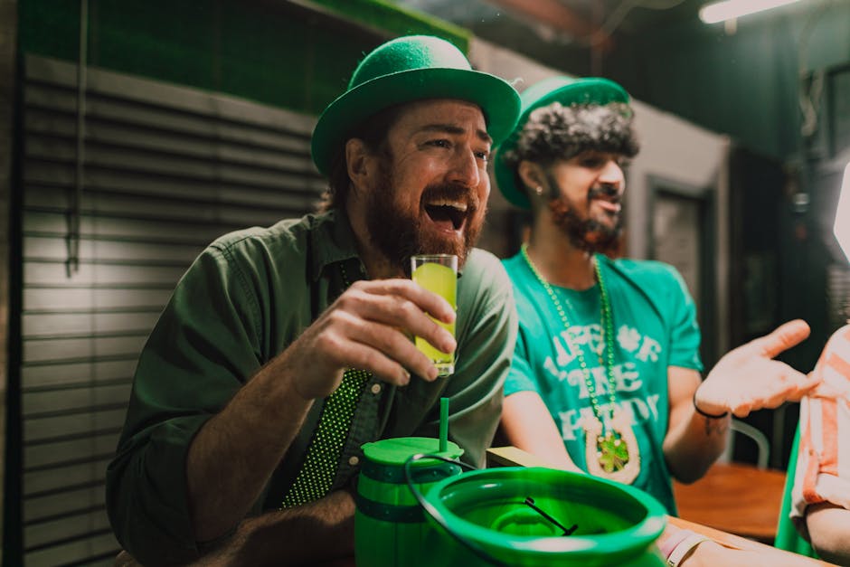 Friends celebrating St. Patrick's Day with drinks in a lively pub setting.